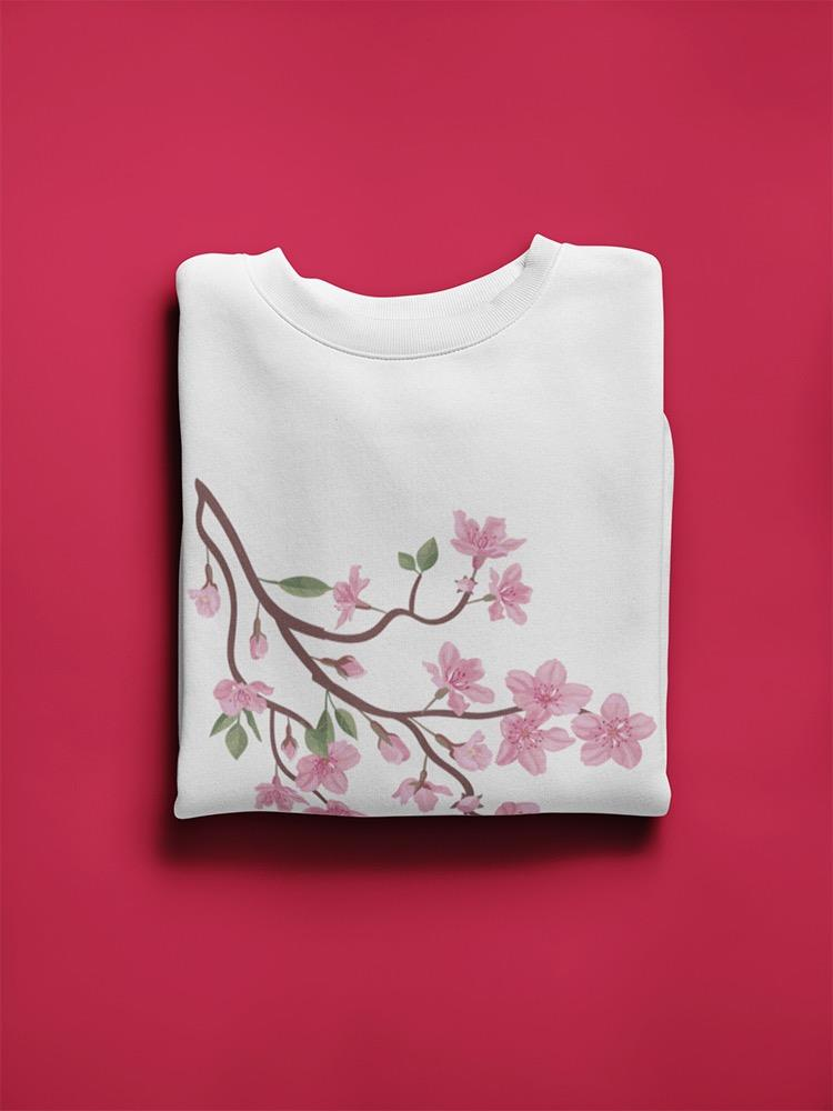 a folded white shirt with pink flowers on it