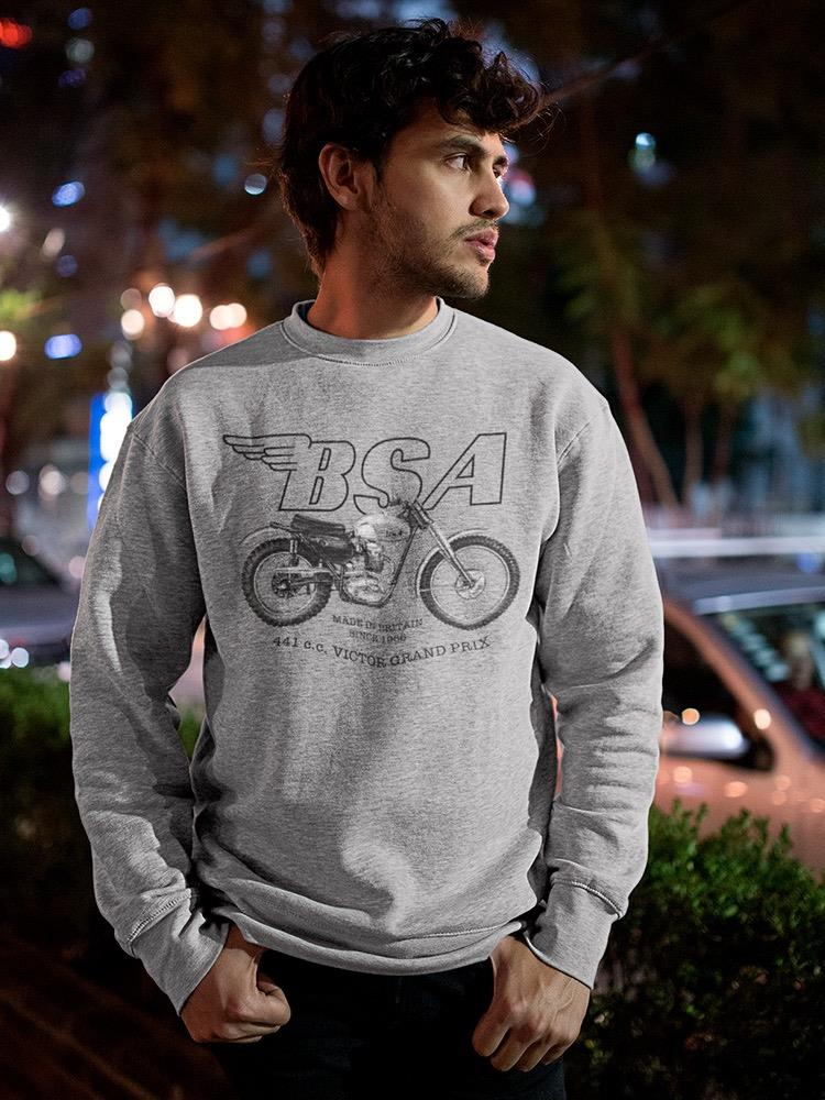 a man in a grey sweatshirt