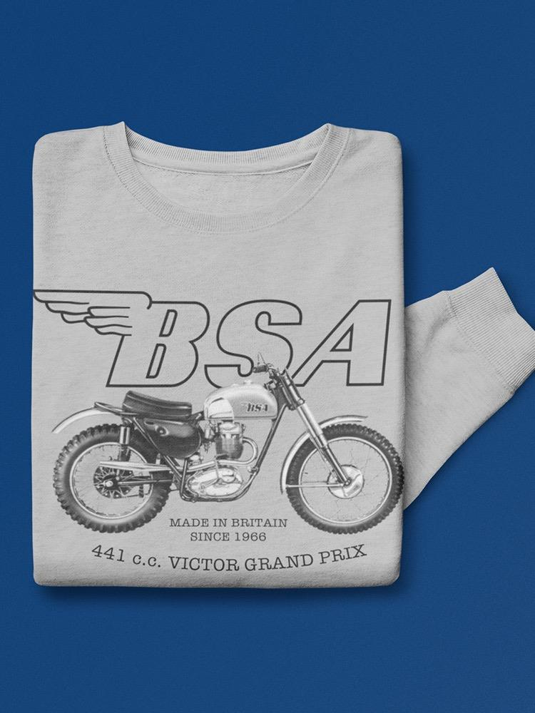 a folded grey shirt with a motorcycle on it
