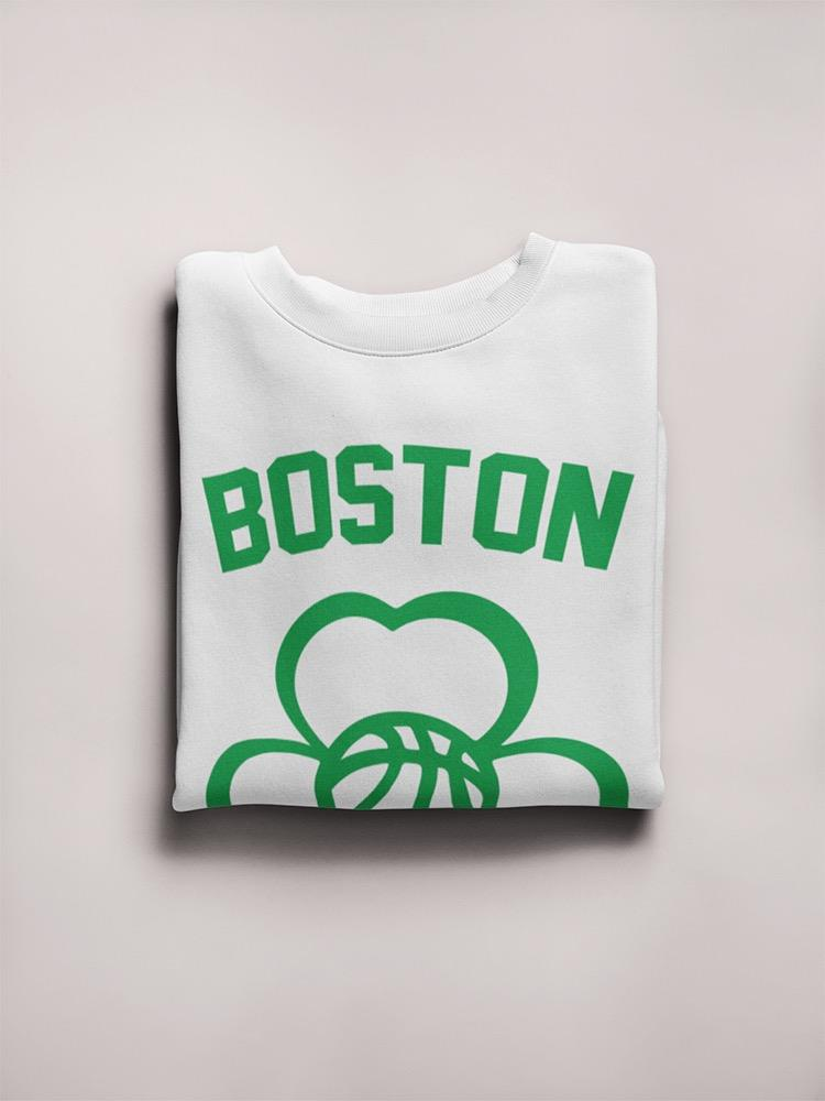 a folded white shirt with green text