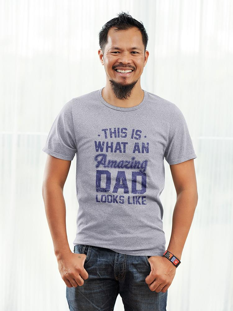 a man smiling with his hands in his pockets