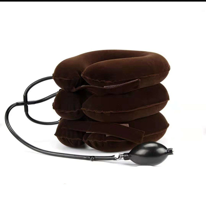 a stack of brown pillow with a black tube