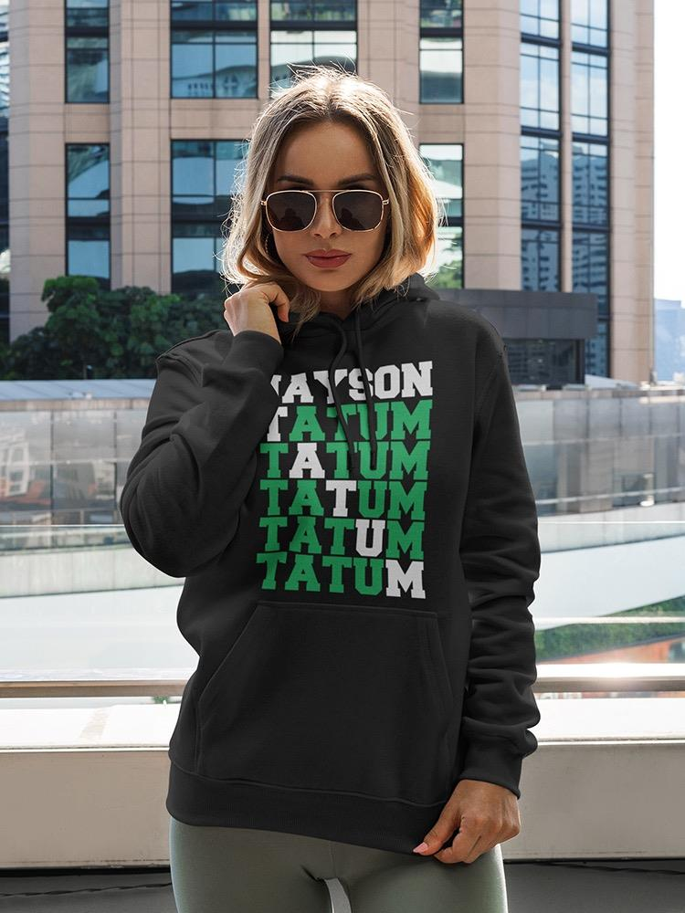 a woman wearing sunglasses and a black hoodie