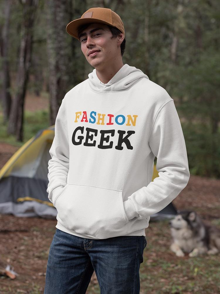 a man in a white sweatshirt with a dog in the background