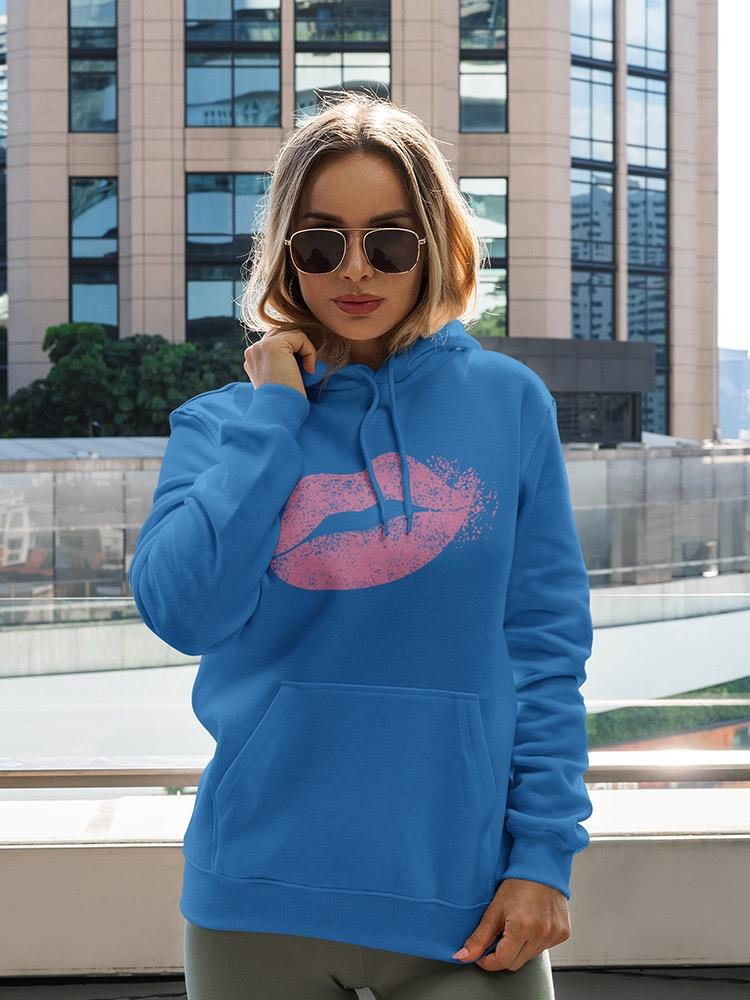 a woman wearing sunglasses and a blue sweatshirt