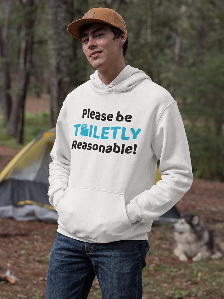 a man in a white sweatshirt with a dog in the background