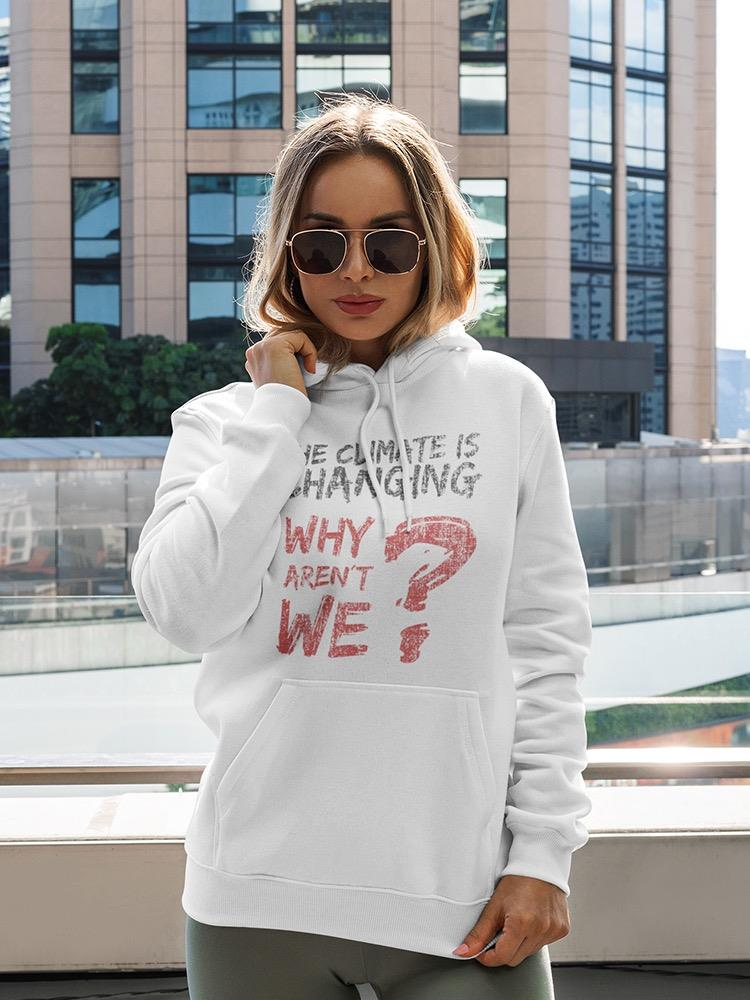 a woman wearing sunglasses and a white hoodie