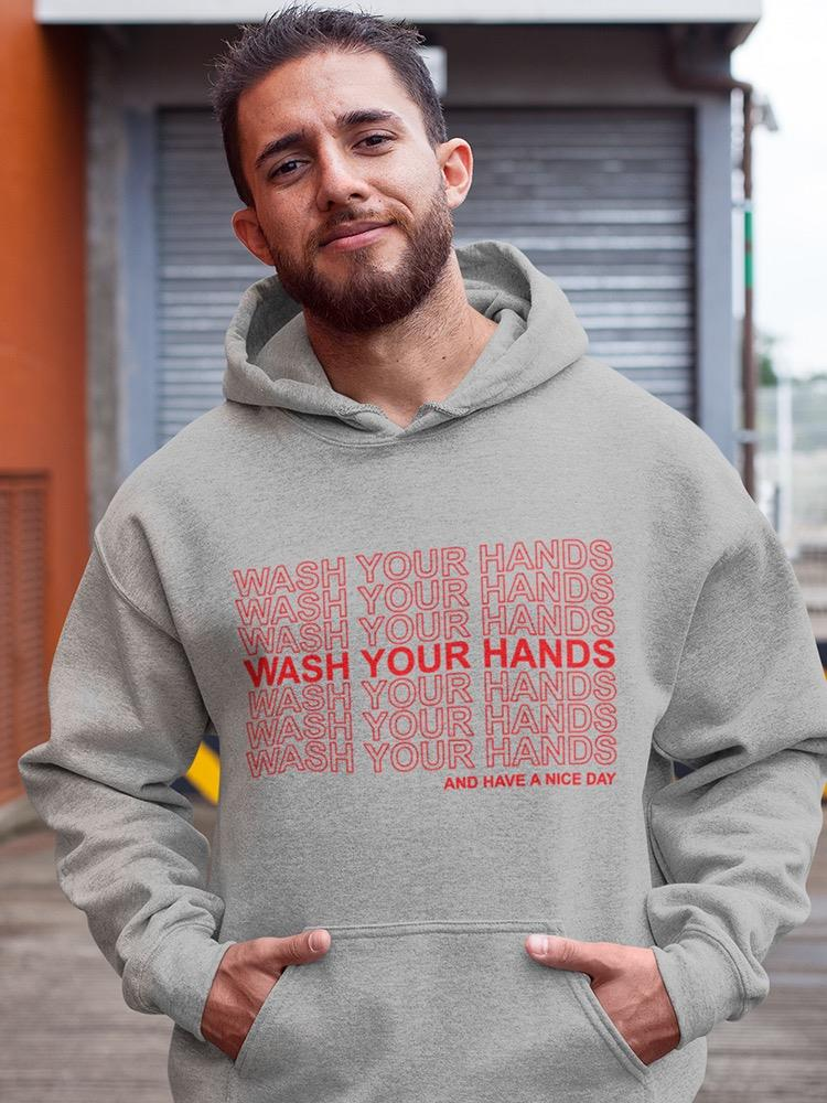 a man with a beard wearing a grey hoodie with red text