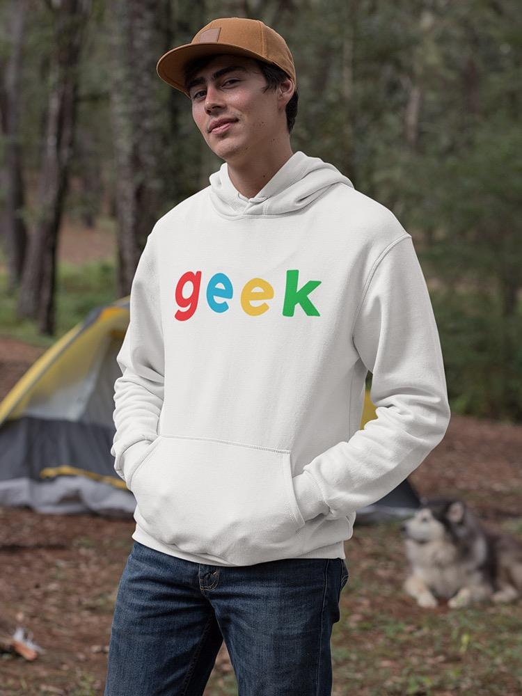 a man in a white sweatshirt with a dog in the background