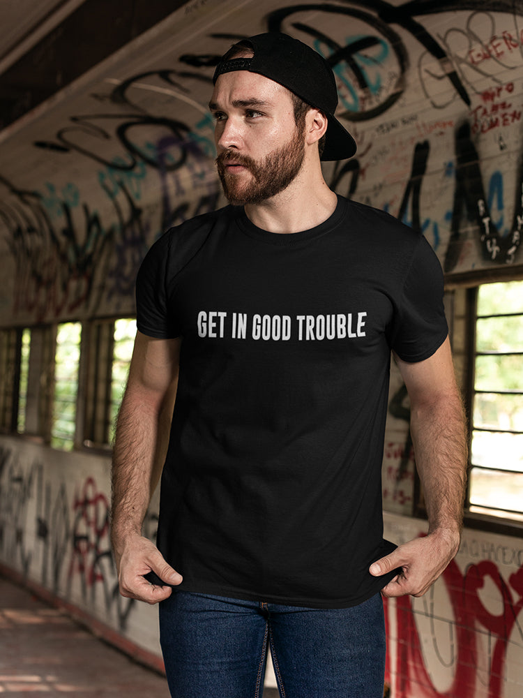 a man wearing a black hat and a black shirt