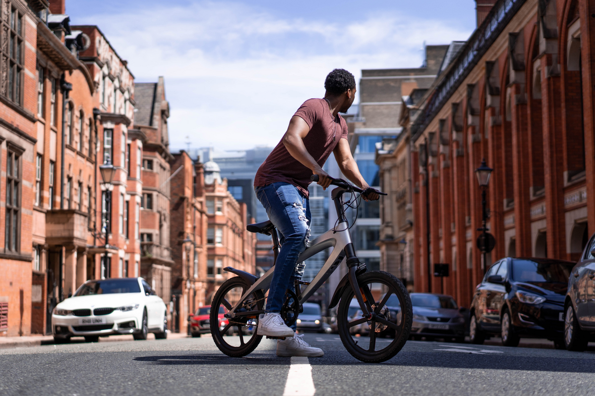 a man riding a bike on a street