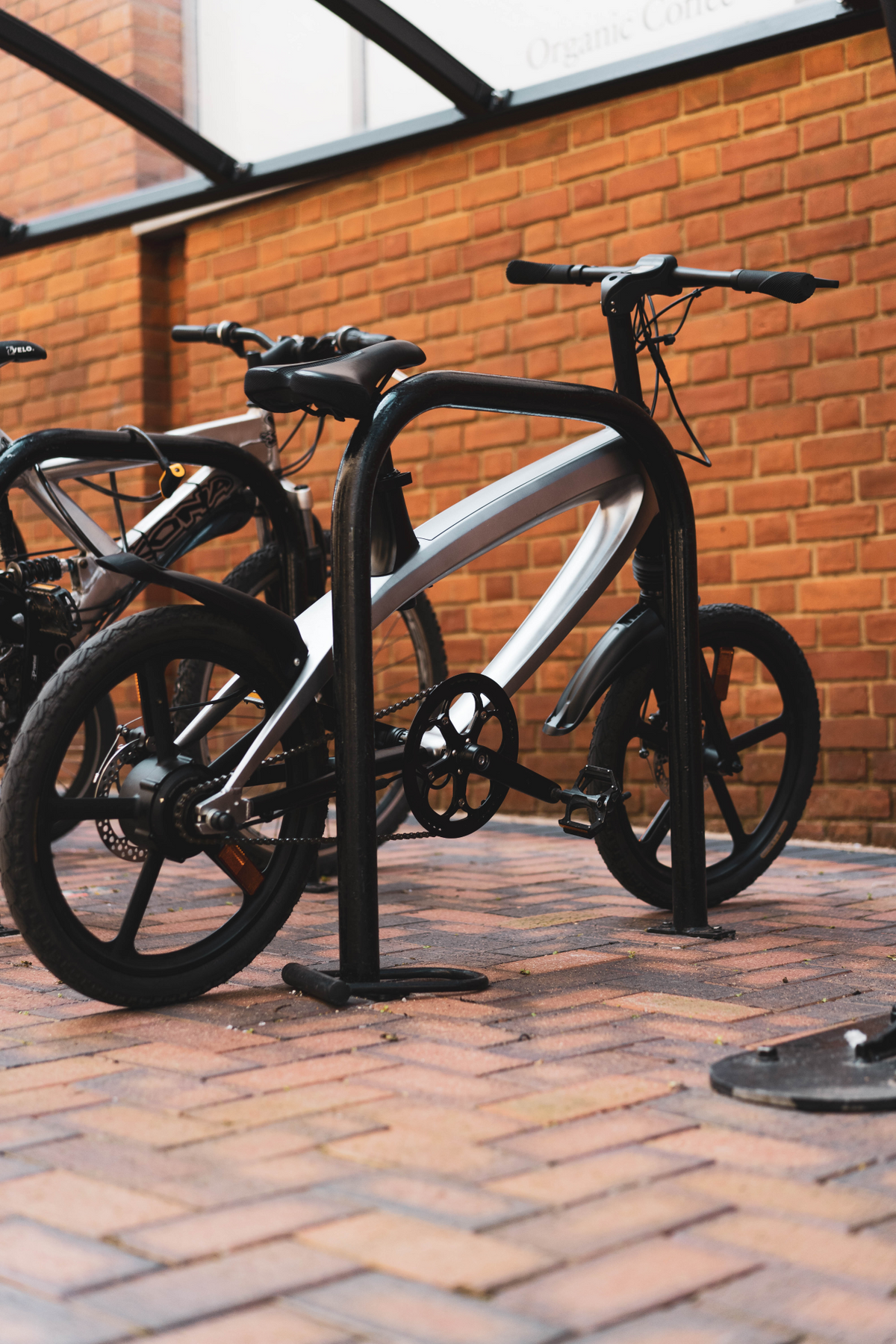 a bicycle parked on a brick surface