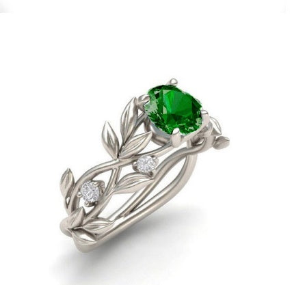 a ring with a green stone