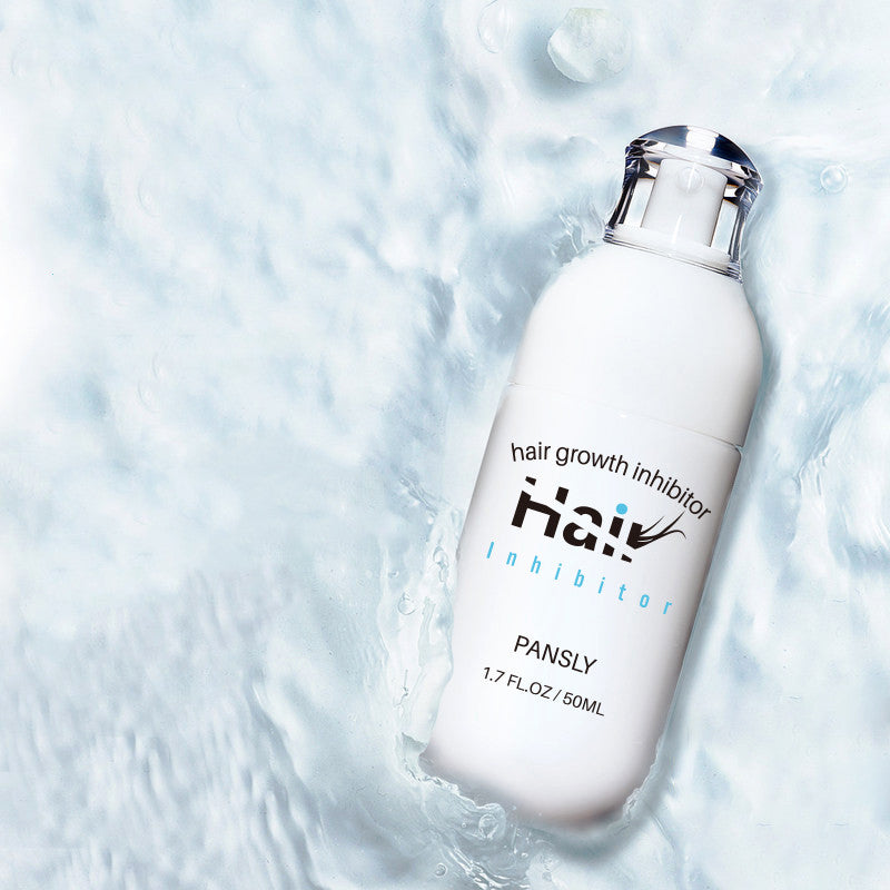 a white bottle of hair growth in water