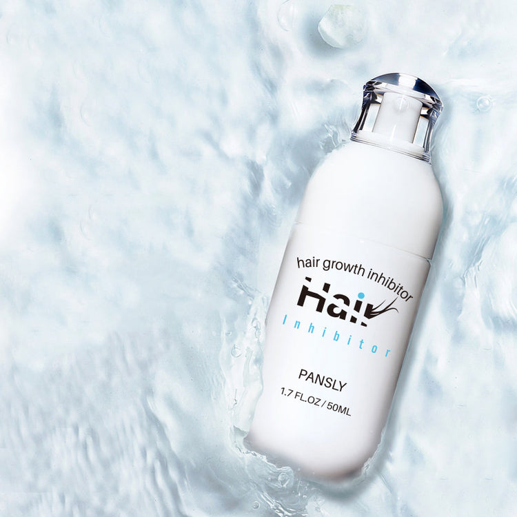 a white bottle of hair growth in water