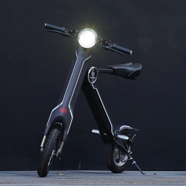a black scooter with a light on it