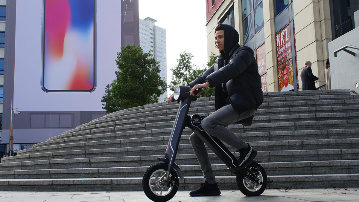a man riding a scooter