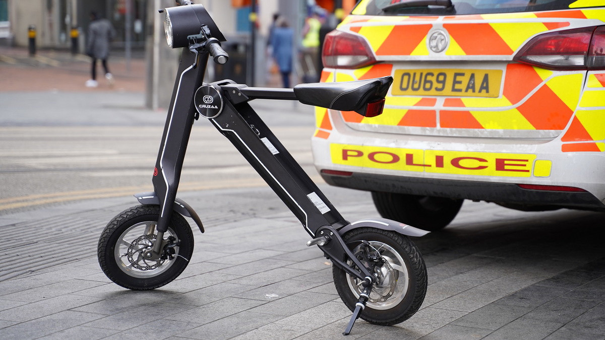 a black bike with a light on the back