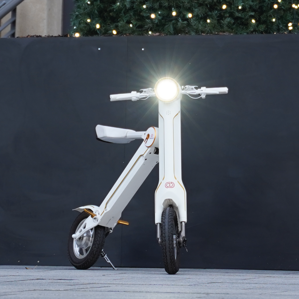 a white scooter with a bright light