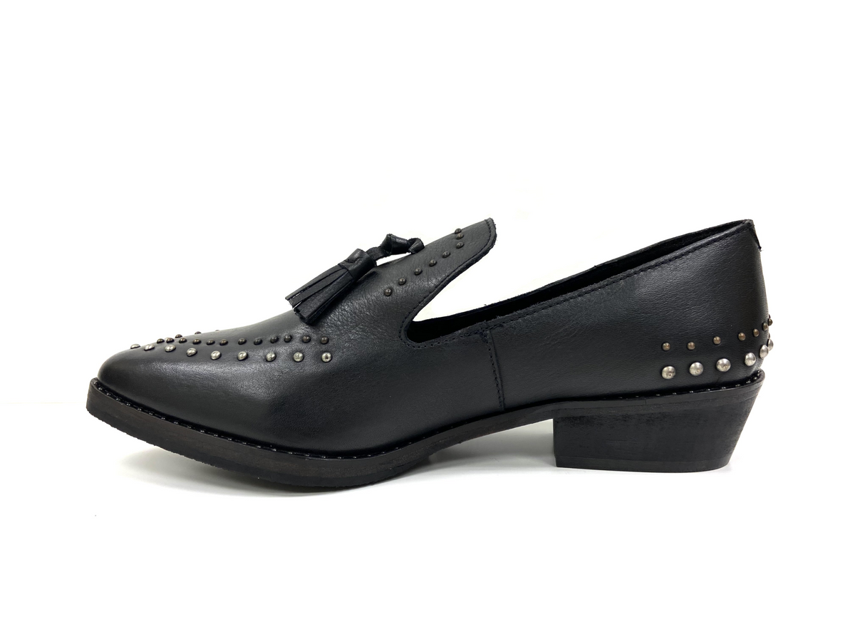 a black shoe with studs