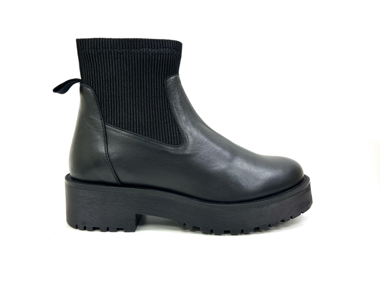 a black boot with a black sock