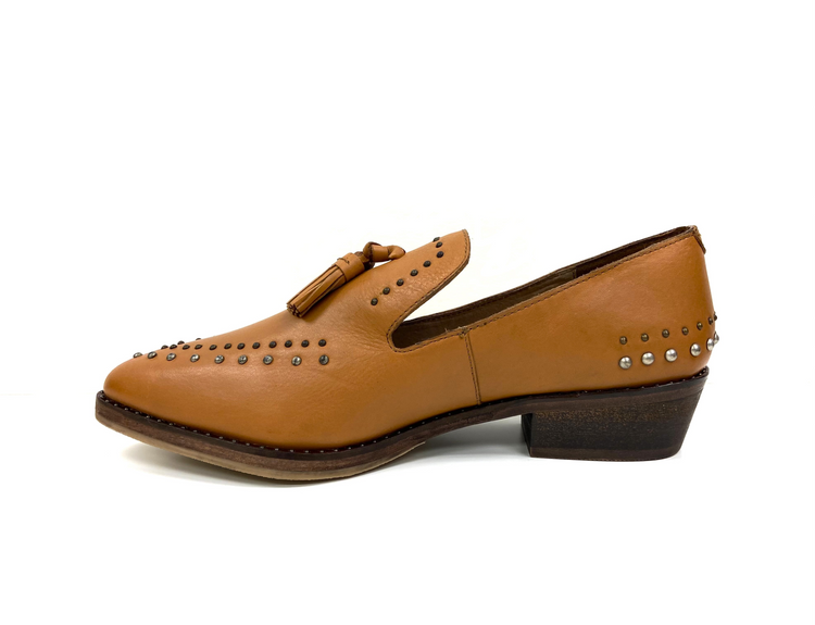 a brown shoe with studs
