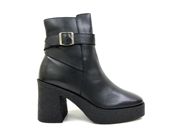 a black boot with a silver buckle