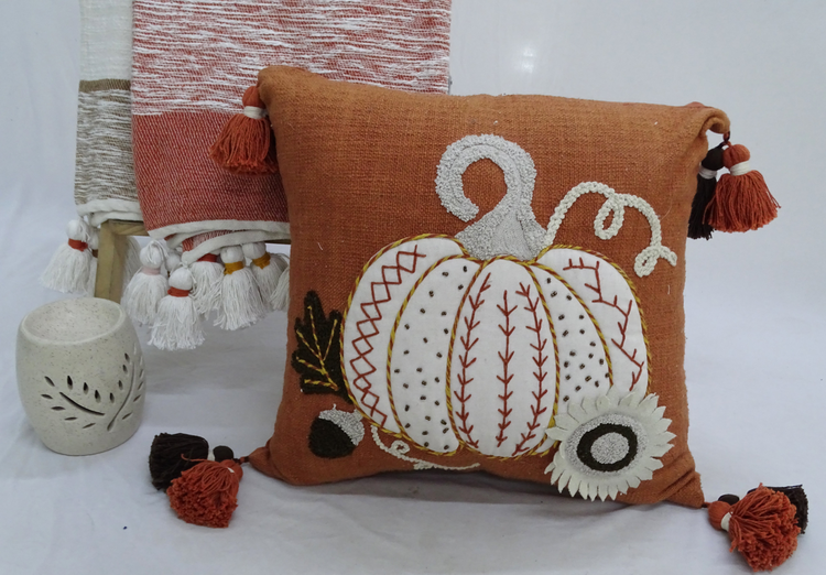 a pillow with a pumpkin design