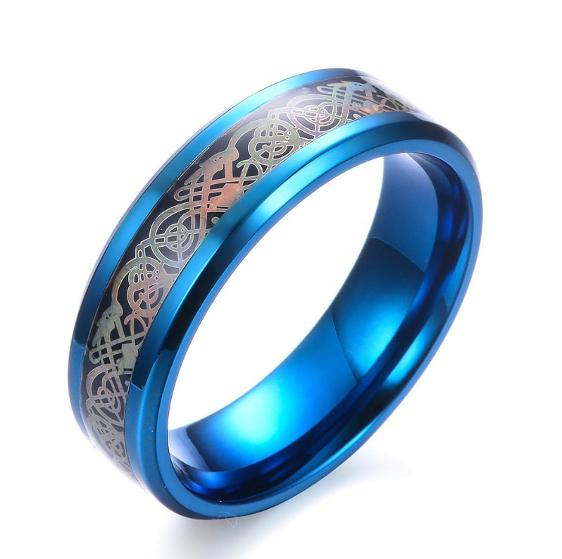 a blue ring with a silver design