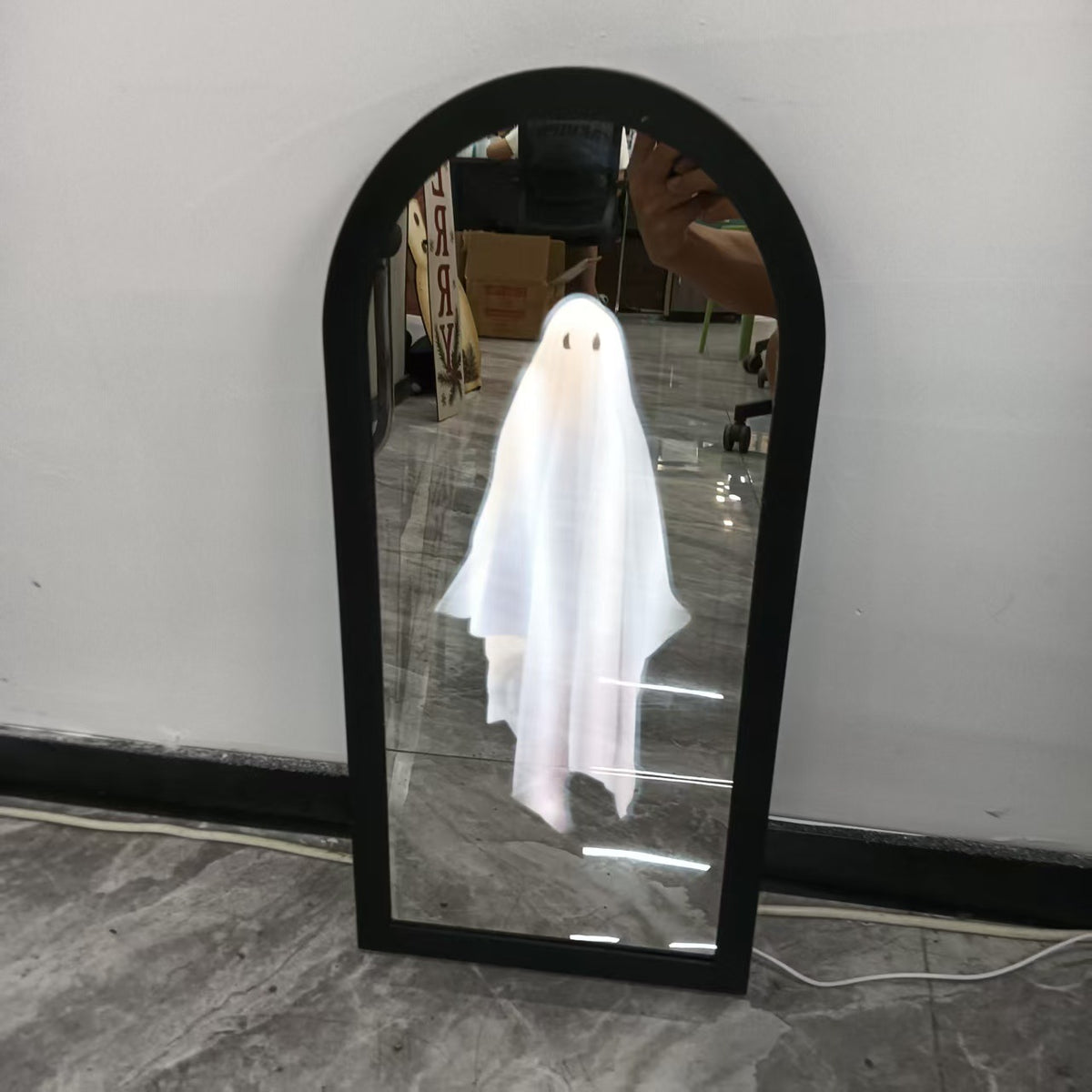 a mirror with a ghost in it