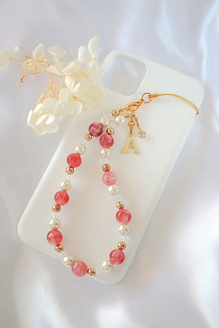 a phone case with a beaded necklace