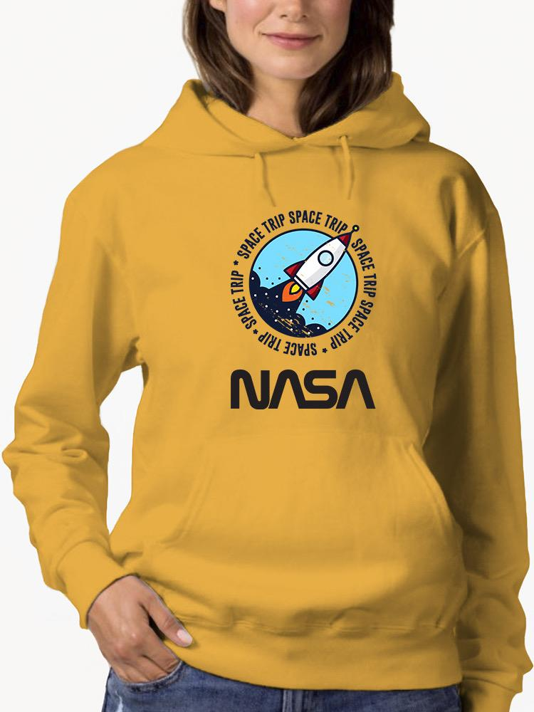 a woman wearing a yellow hoodie