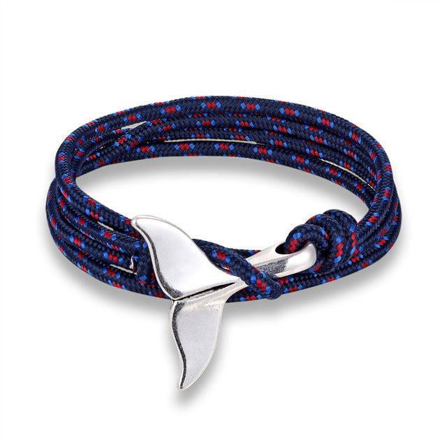 a blue and red rope bracelet with a silver whale tail