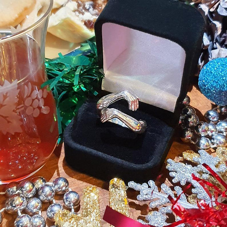 a ring in a box with decorations