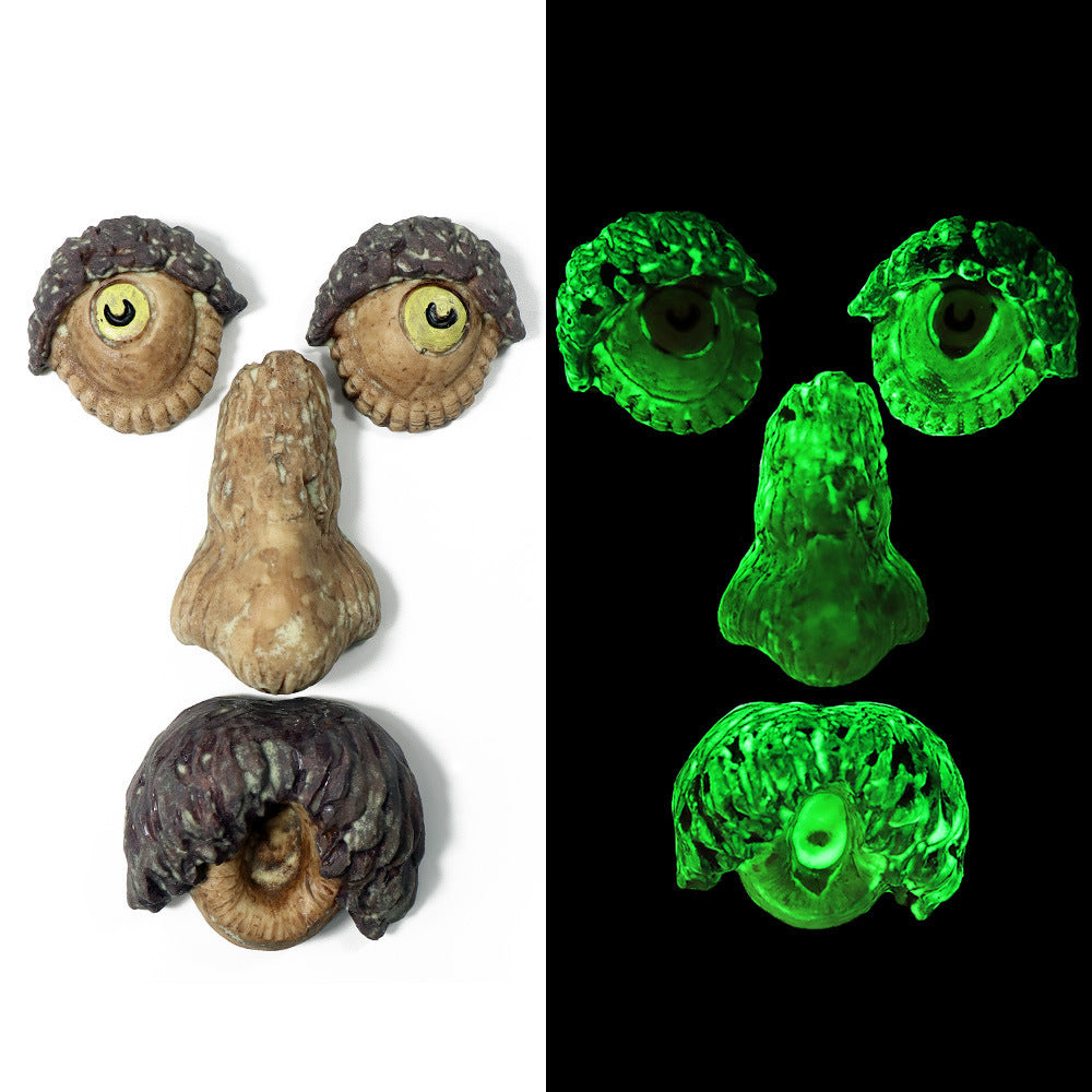 a face made of rocks and a green light