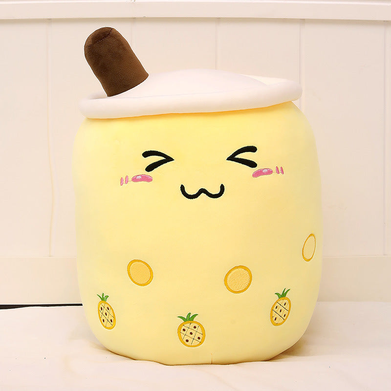 a yellow pillow with a face on it