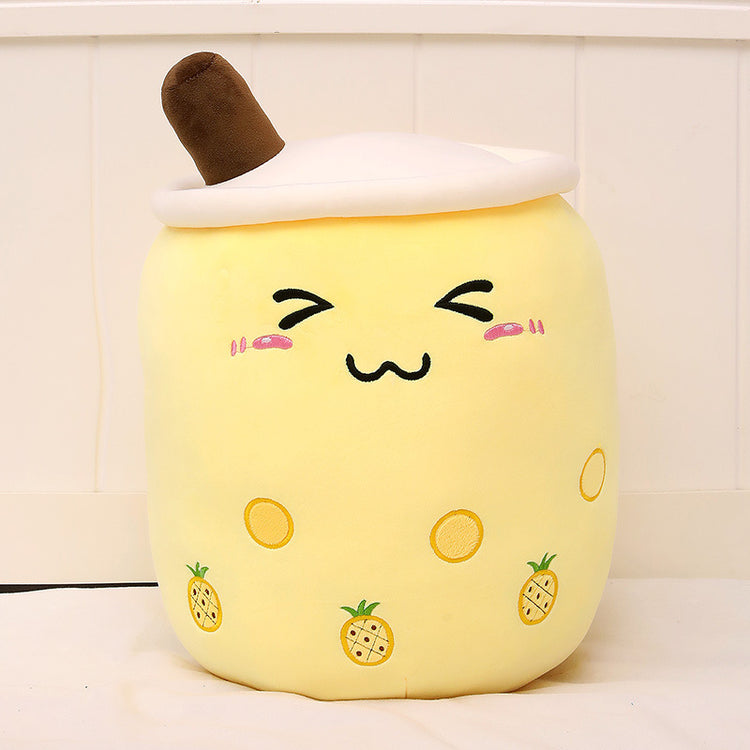 a yellow pillow with a face on it