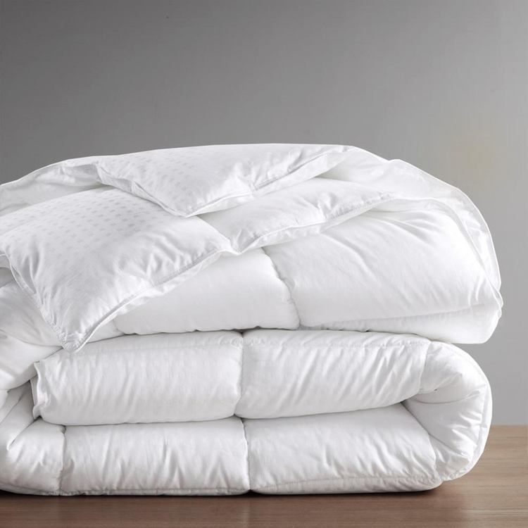 a stack of white blankets