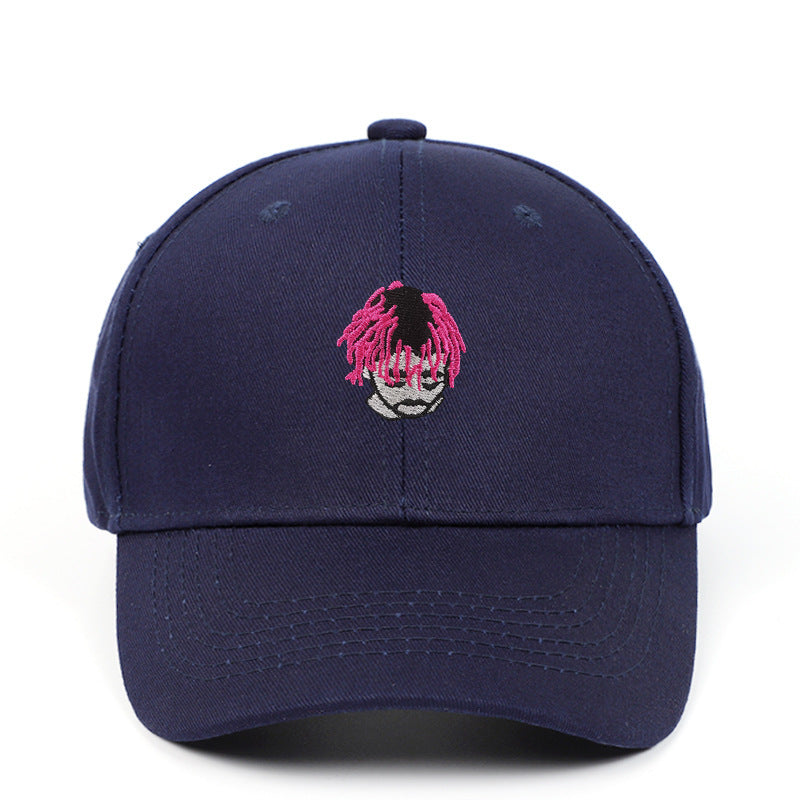a blue hat with a pink hair on it