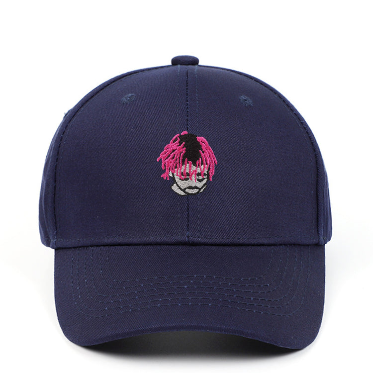 a blue hat with a pink hair on it