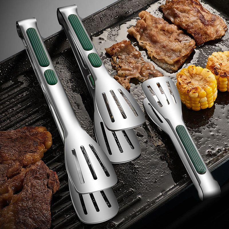 a grill pan with tongs and tongs on it
