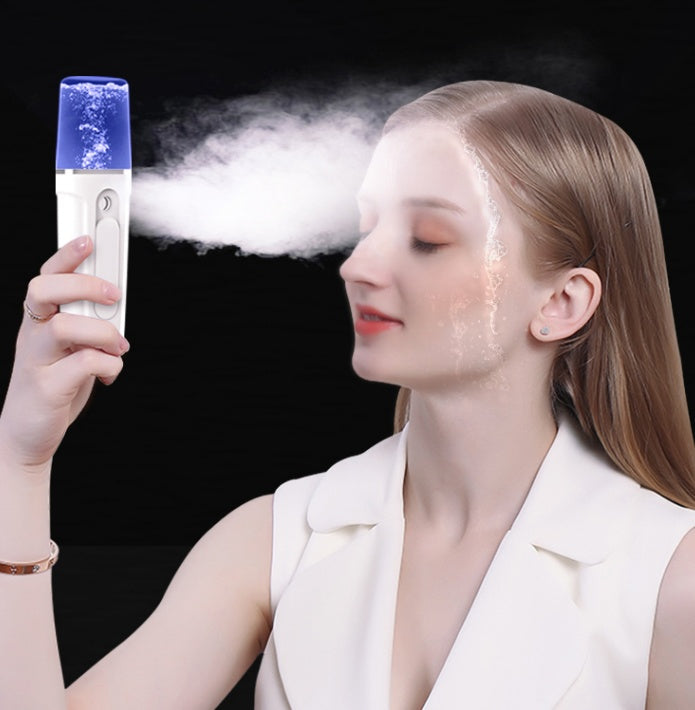 a woman spraying a vaporizer