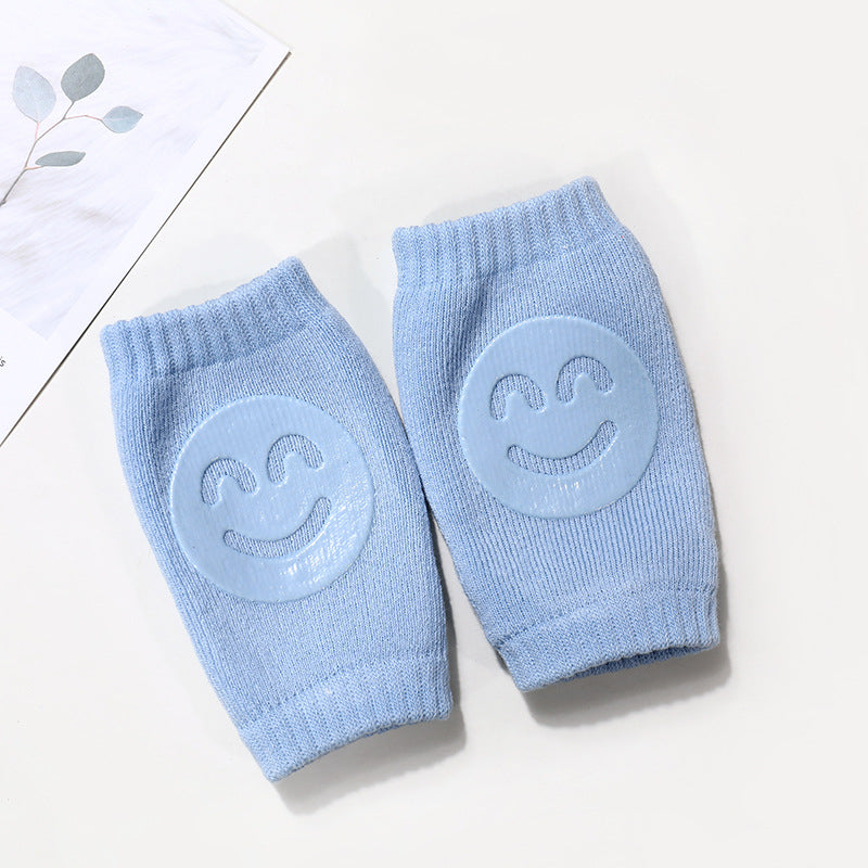 a pair of blue socks with smiley faces on them