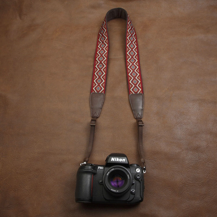 a camera on a leather surface