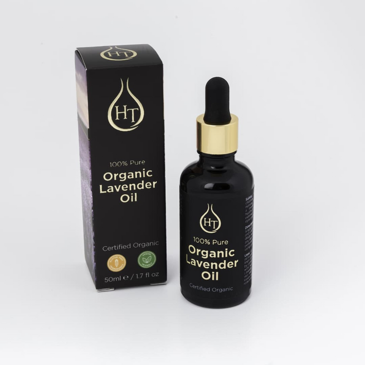 a bottle of lavender oil next to a box