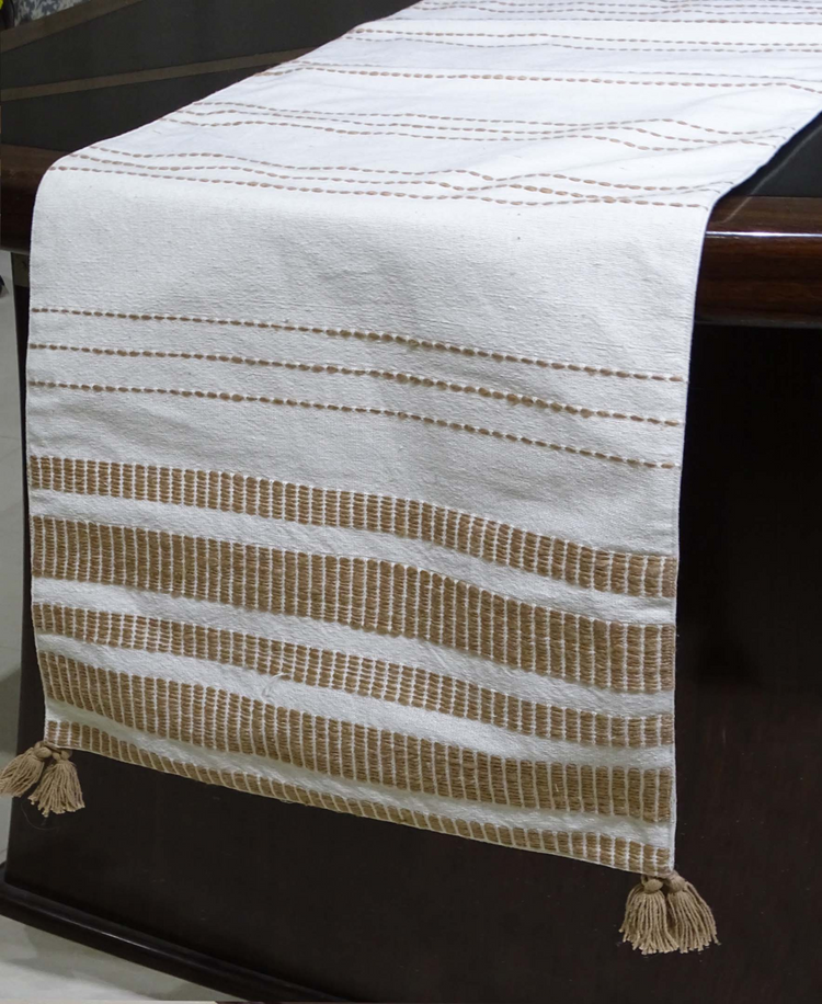 a white and brown table runner