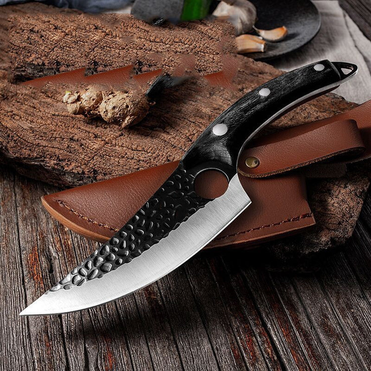 a knife on a wood surface