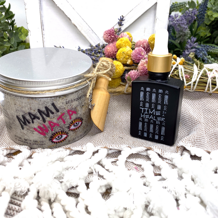a jar of scrub and a bottle of oil