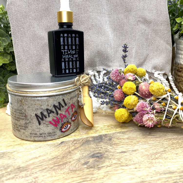 a jar of oil and flowers