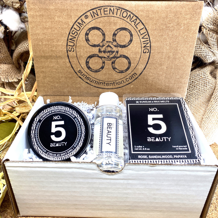 a box with a small bottle and a small bottle in it